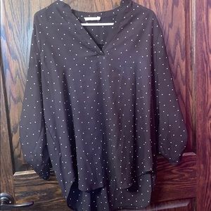 A black and white polka dot blouse.